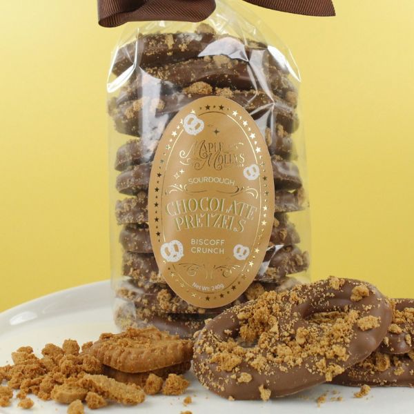 Milk chocolate pretzels topped with Biscoff crunch