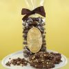 Milk chocolate coated pretzels topped with honeycomb pieces